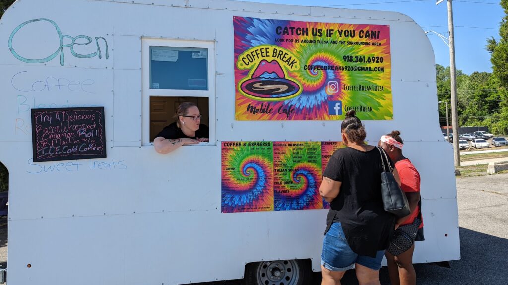 Mother and daughter checking out the options at a beverage food truck at EAT36STN